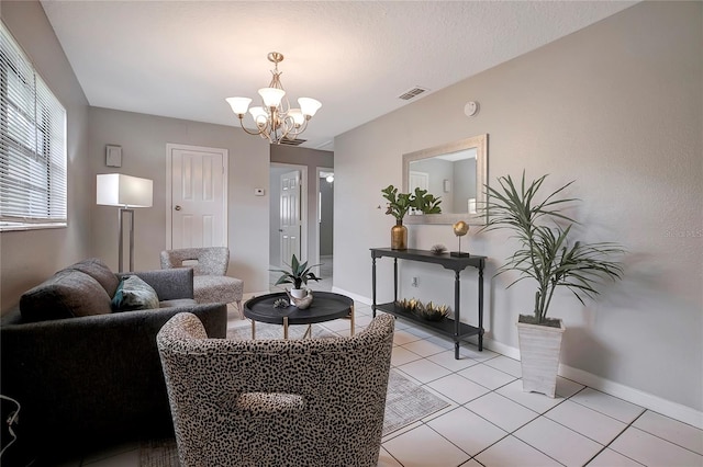 tiled living room with a chandelier