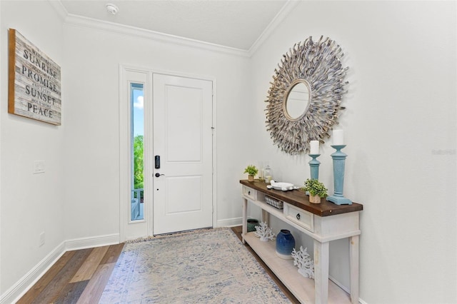 entryway featuring ornamental molding and hardwood / wood-style flooring