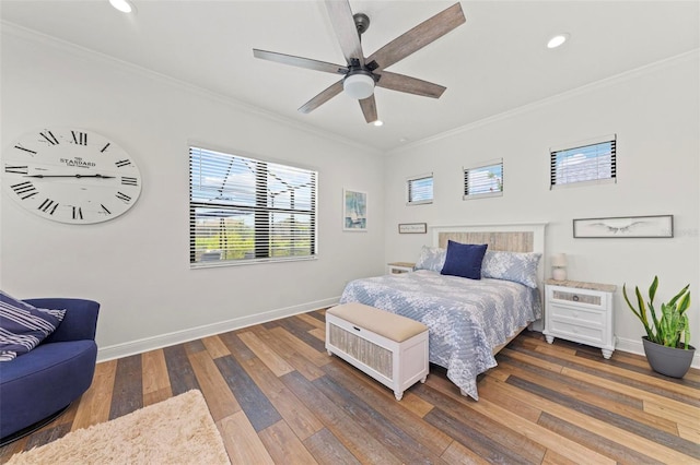 bedroom featuring ceiling fan, dark hardwood / wood-style floors, and crown molding