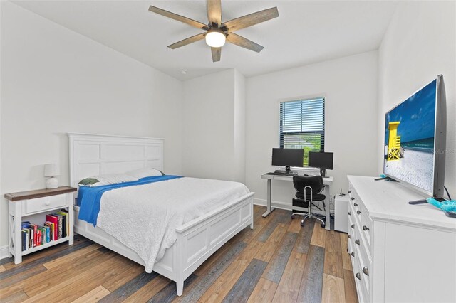 bedroom featuring ceiling fan and dark wood-type flooring