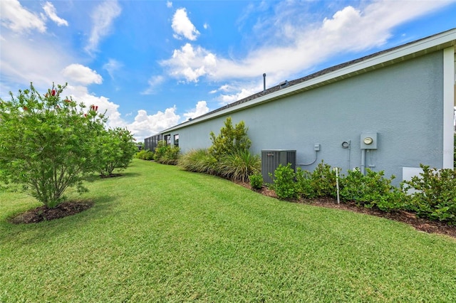 view of yard with central AC