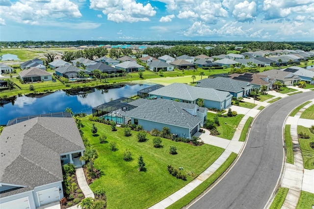 birds eye view of property with a water view