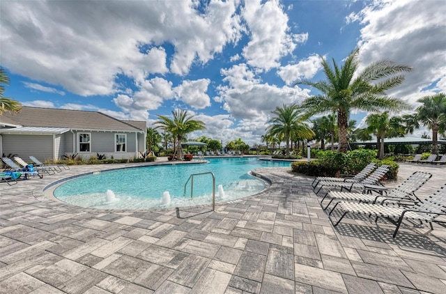 view of swimming pool featuring a patio area and pool water feature