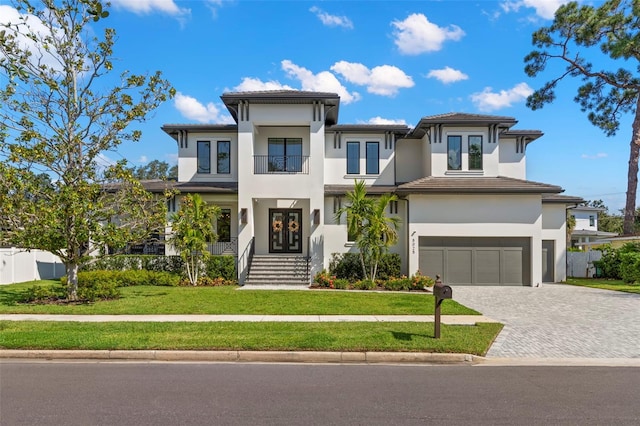 view of front facade featuring a front yard and a garage