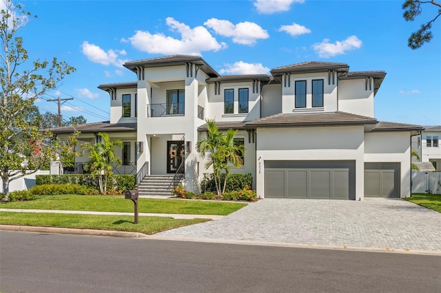 view of front facade with a front yard and a garage