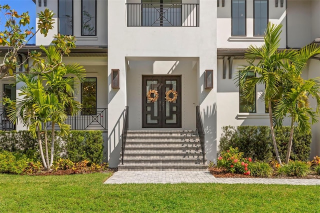 doorway to property featuring a yard