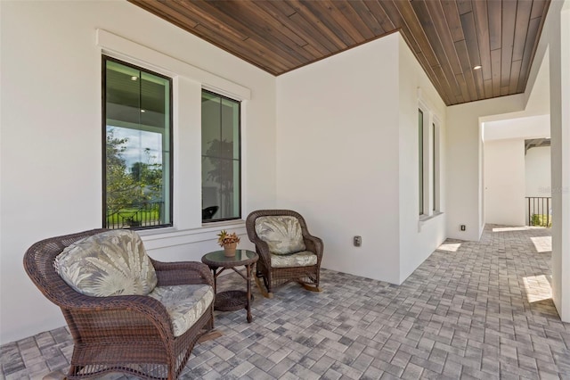 sitting room featuring wooden ceiling