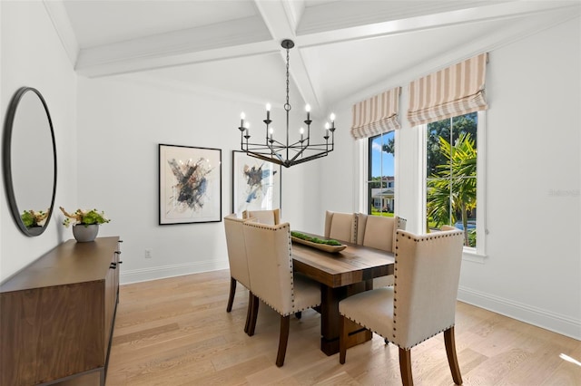 dining room with an inviting chandelier, light wood-type flooring, crown molding, and beam ceiling