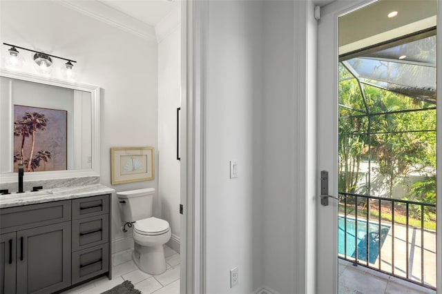 bathroom featuring vanity, crown molding, toilet, and tile patterned flooring