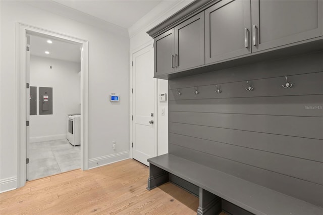 mudroom with electric panel and light hardwood / wood-style floors