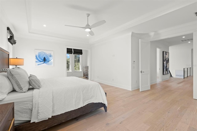 bedroom featuring light hardwood / wood-style flooring, ceiling fan, and crown molding