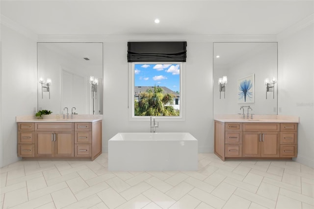 bathroom featuring crown molding, vanity, and a washtub