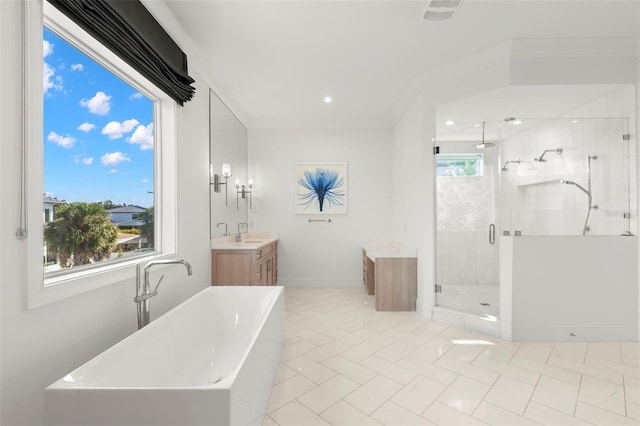 bathroom with crown molding, tile patterned flooring, vanity, and separate shower and tub