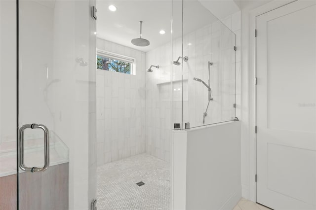 bathroom with tile patterned floors and an enclosed shower