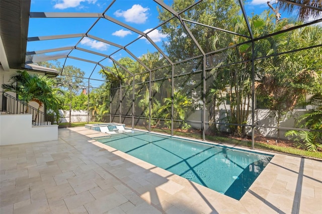 view of swimming pool featuring a patio and a lanai