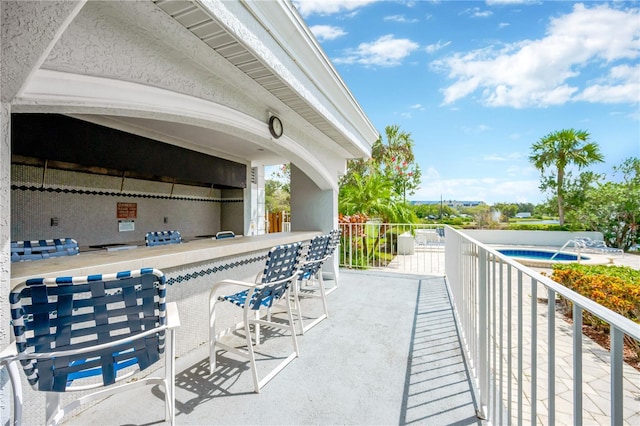 view of patio featuring a bar