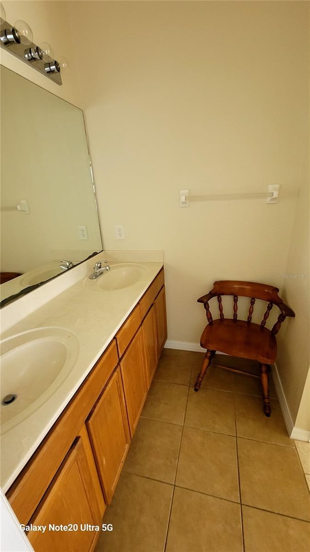 bathroom with tile patterned floors and vanity