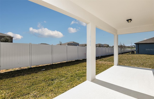 view of yard featuring a patio area and a fenced backyard