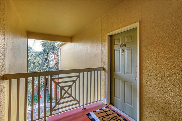 entrance to property with a balcony