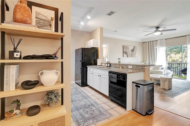 kitchen featuring light wood-type flooring, black appliances, ceiling fan, and white cabinetry