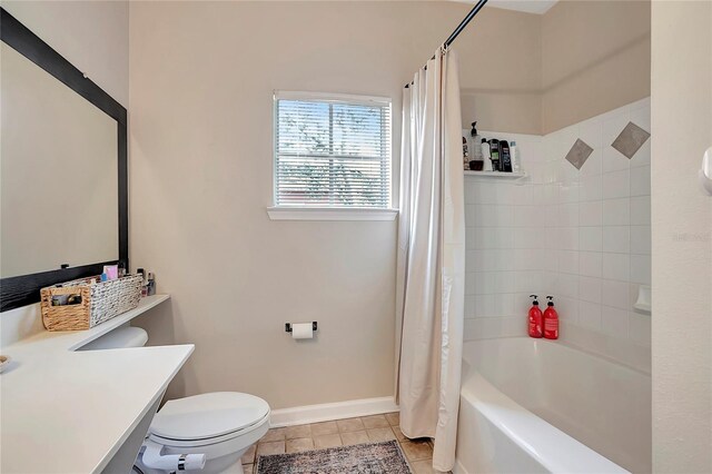 full bathroom featuring shower / bath combination with curtain, vanity, toilet, and tile patterned floors