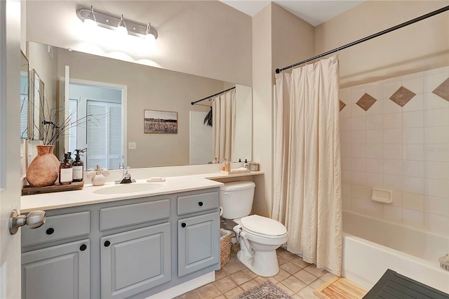 full bathroom with shower / bath combination with curtain, vanity, tile patterned flooring, and toilet