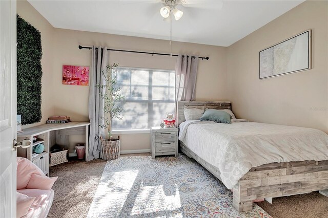 bedroom with light carpet and ceiling fan