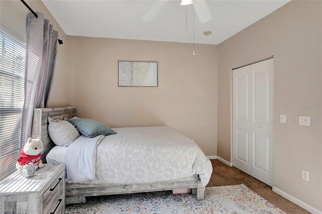 bedroom featuring a closet, ceiling fan, and carpet floors