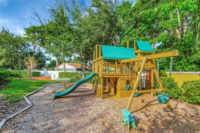 view of jungle gym featuring a yard