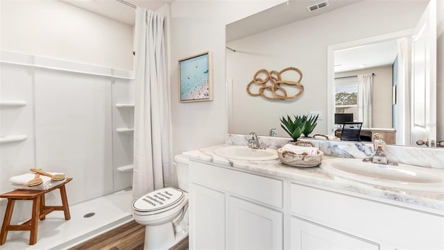 bathroom featuring a shower with curtain, vanity, toilet, and hardwood / wood-style floors