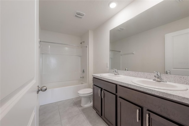 full bathroom featuring tub / shower combination, vanity, toilet, and tile patterned floors