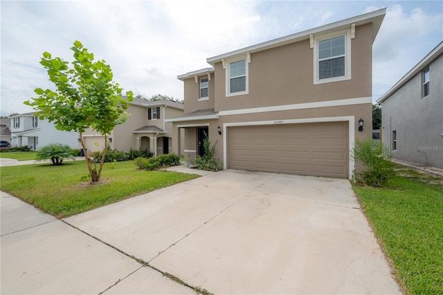 view of front of home featuring a front yard and a garage