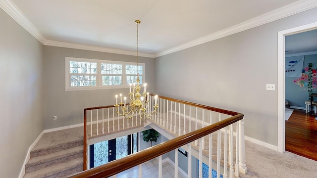 hallway featuring wood-type flooring, a notable chandelier, and ornamental molding