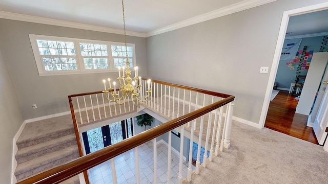 hallway featuring hardwood / wood-style flooring, crown molding, and a chandelier