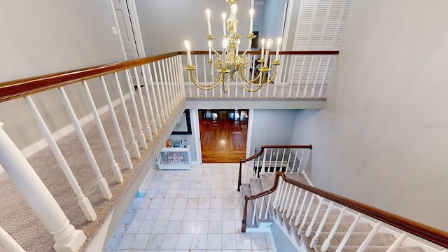 stairway with an inviting chandelier