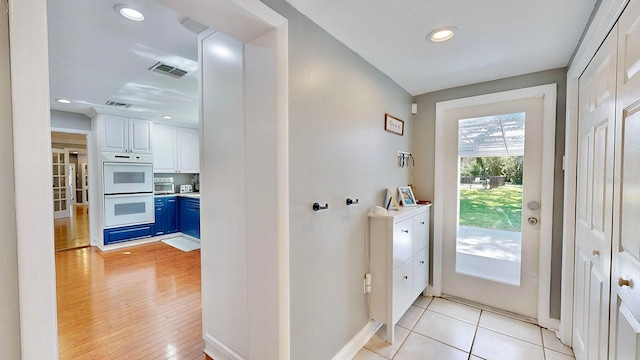 doorway to outside with light hardwood / wood-style floors