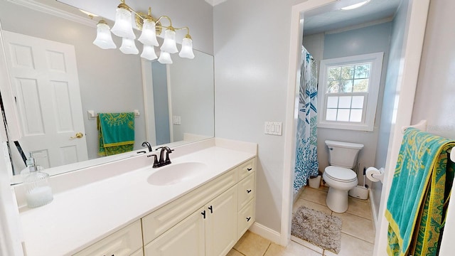 bathroom with ornamental molding, tile patterned floors, vanity, and toilet