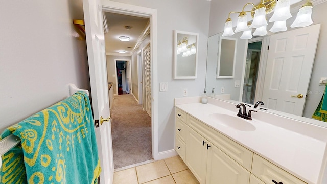 bathroom with vanity, crown molding, and tile patterned floors