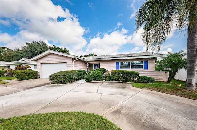 single story home featuring a garage