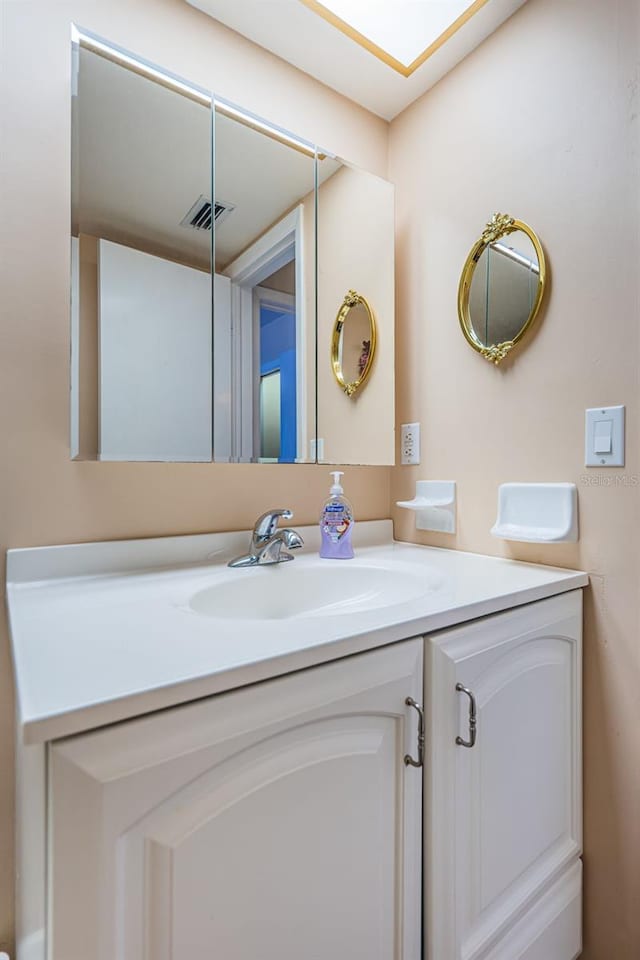 bathroom featuring visible vents and vanity