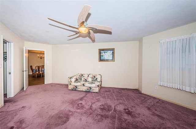 unfurnished room featuring carpet floors and ceiling fan with notable chandelier