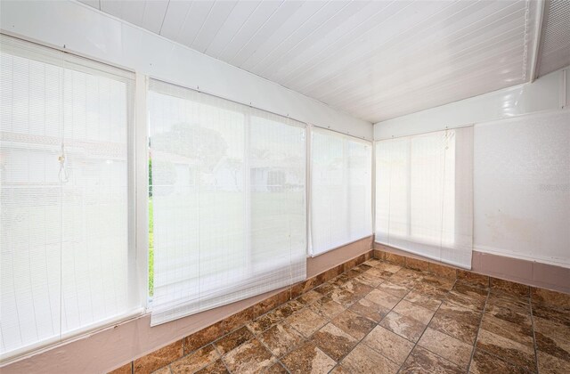 spare room with stone finish floor