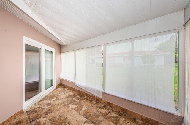 unfurnished sunroom featuring wood ceiling