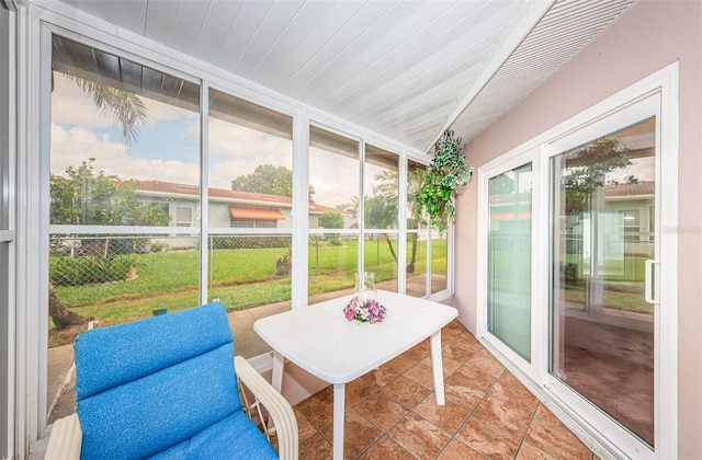 sunroom with wooden ceiling