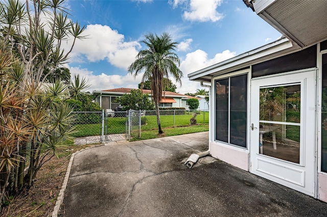 view of patio with a gate and fence