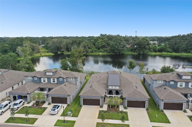 birds eye view of property with a water view