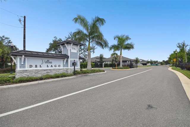 281 Villa Corte Dr, Lutz, FL 33549 - view of asphalt street featuring traffic signs and curbs