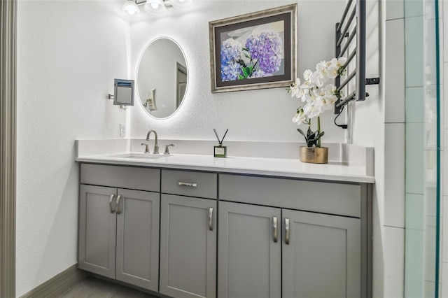 bathroom featuring vanity and wood-type flooring