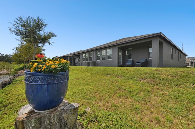 281 Villa Corte Dr, Lutz, FL 33549 - view of green lawn with central AC unit
