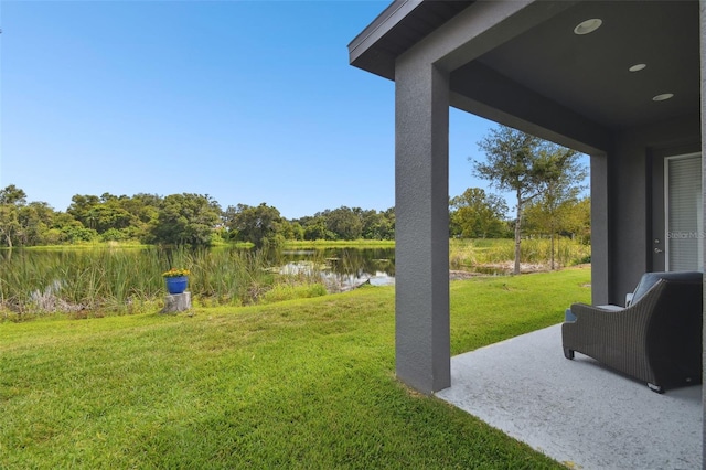 281 Villa Corte Dr, Lutz, FL 33549 - view of grassy yard with a water view and a patio area